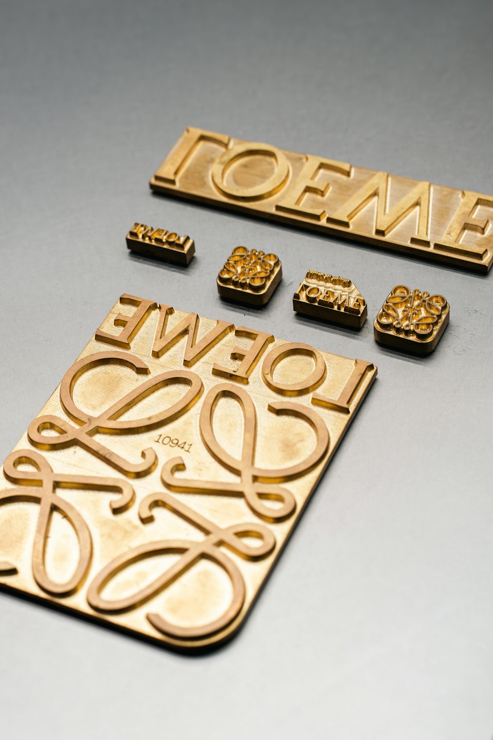 Brass stamping dies and plates for the LOEWE logo.